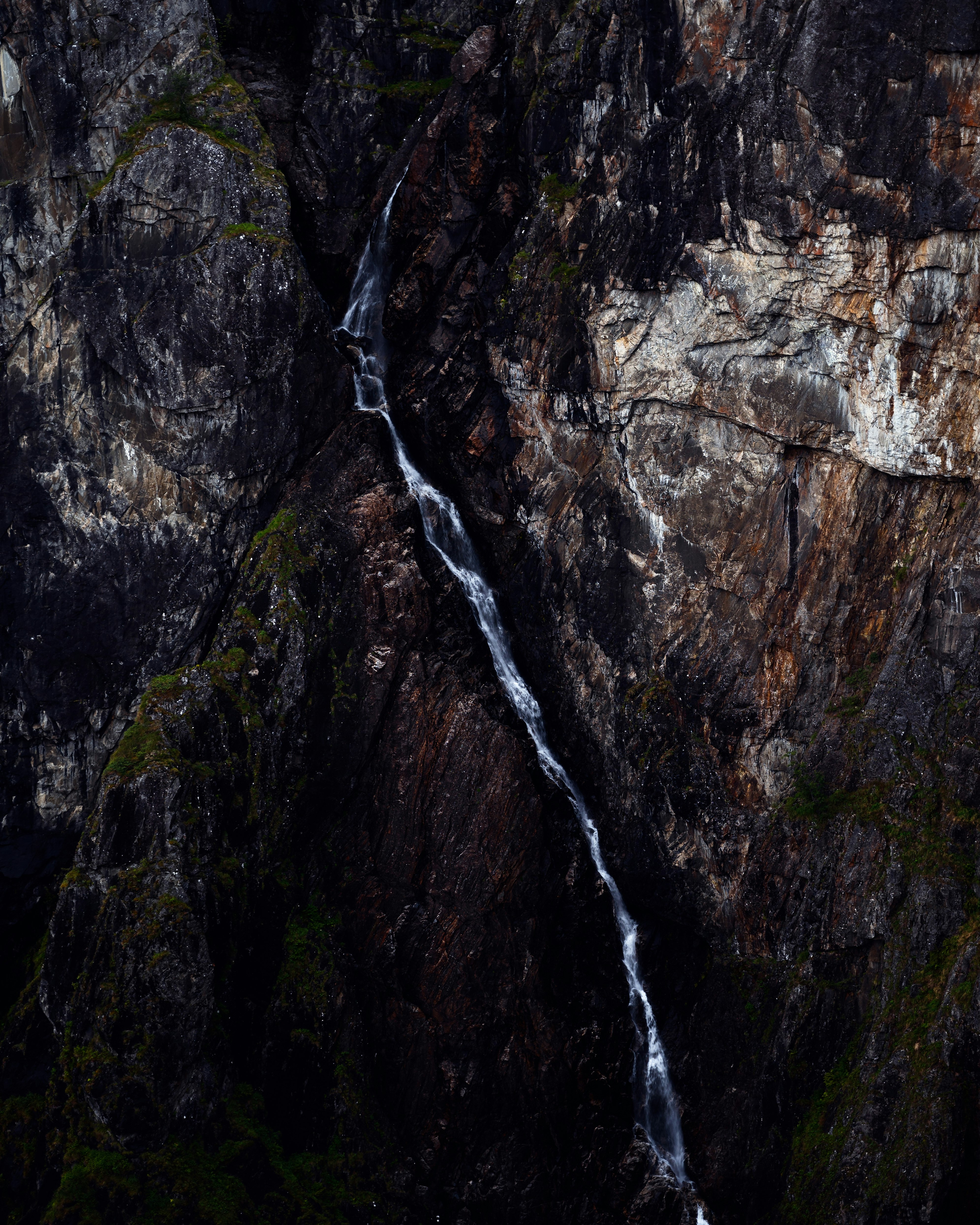 water falls on rocky mountain